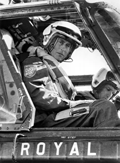 Crash Helmet Prints: High Flyer Prince Charles at the controls of a helicopter in September 1974 during his