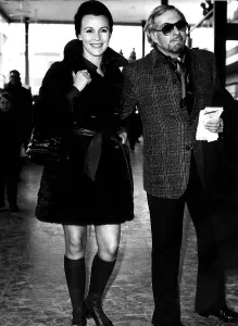 Boots And Shoes Prints: Hilliard Elwim with wife Claire Bloom actress at Heathrow Airport dbase