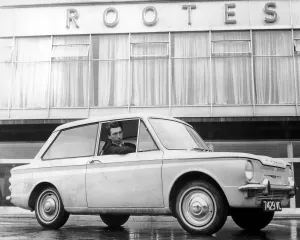 Hilman Imp car, positioned outside the Linford Factory that has been taken over my Rootes