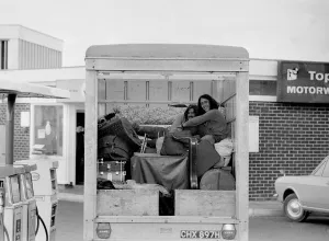 Core76 Prints: Two hitch-hikers getting a comfortable lift in the back of a truck September 1970