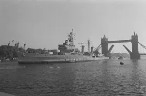 Thames Prints: HMS Belfast sailing up the Thames 1971 passing through Tower Bridge to her mooring