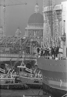 Core83 Prints: HMS Belfast sailing up the Thames passing St Pauls Cathedral to her mooring in the Pool
