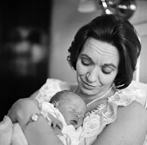 Holding her 12-hour old baby is stage and TV actress Lillias Walker