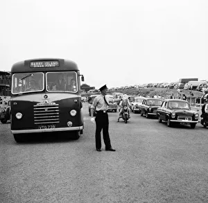Coach Prints: Holiday Crowds at Barry Island: Two Barry policeman control the dangerous crossing point