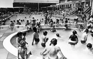 Lido Prints: Holiday makers enjoy the Swimming and Paddling Pools at Trecco Bay, Porthcawl, Bridgend