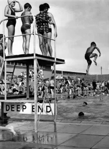 00658 Prints: Holiday makers enjoy the Swimming and Paddling Pools at Trecco Bay, Porthcawl, Bridgend