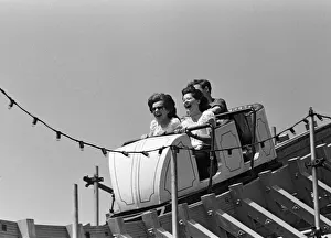 Tourism Prints: Holiday scenes in Brighton, East Sussex on the Whitsun bank holiday. 15th May 1964