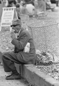 East Sussex Prints: Holiday scenes at Brighton Elderly holidaymaker seen here enjoying an ice cream to