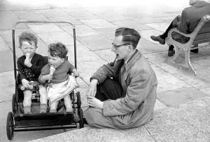 00012 Prints: Holiday scenes. in and around Hastings. Two young boys in their pram enjoy a holiday ice
