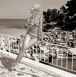 Holiday in Spain Women wearing swimming costumes bathing suit bikinis July