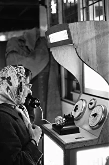 Holidaymaker Prints: Holidaymaker sheltering from the rainy weather at the end of Southend pier
