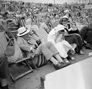 Holidaymakers Prints: Holidaymakers at Bognor Regis breakdown in fits of laughter as a deckchair breaks under