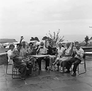 Tourists Prints: Holidaymakers enjoying a drink at Sandy Bay Caravan site, near Exmouth, Devon