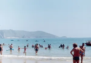 Channel Islands Prints: Holidaymakers and locals enjoy a day out on the beach on the Channel Island of Jersey