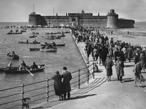 Holiday Prints: Holidaymakers making the most of the August Bank holiday sun at Peach Rock Battery on New