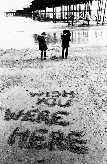 00178 Prints: Holidaymakers Mike and Maggie Markham on the beach at Brighton Sussex during a June with