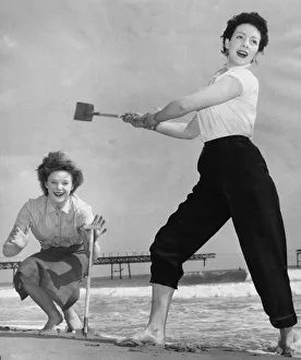 Wicket Prints: Holidaymakers play a game of cricket on the sands at Bournmouth Nicola Wells batting with