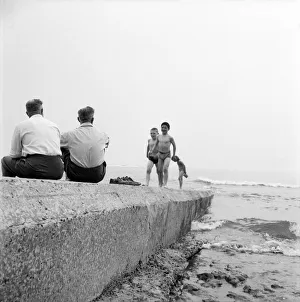 Sunshine Prints: Holidaymakers on a sewerage pipe on the beach at Tynemouth near Newcastle Upon Tyne