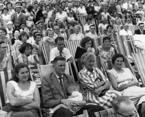 Holidaymakers Sun bathing whilst watching The Minor Beach fashion show