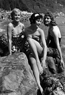 Holidays: Three bathing beauties seen here sunbathing on a Devon beach. July 1958 P013217