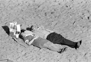 Resting Prints: Holidays: Beach scenes: People relaxing at Margate enjoying the unusually fine warm
