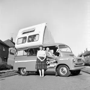 Camper Prints: Holidays: Camping. The Astley family seen here getting to grips with their new Dormobile