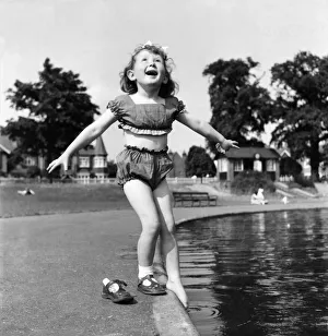 Holidays, little girl modelling swimsuit. June 1953 D3299-005