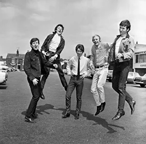 00122 Prints: The Hollies pop group in happy mood in Stockport after hearing news that their latest