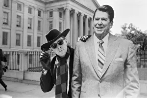 Holly Johnson posing outside the White House with a full-size cutout of Ronald Reagan