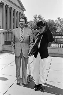 Holly Johnson posing outside the White House with a full-size cutout of Ronald Reagan