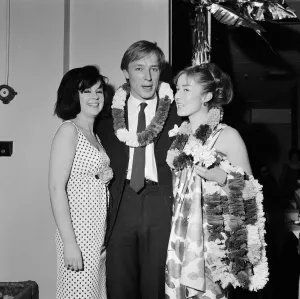 Floral Prints: Honey Pop singer Mike Sarne with Vicki More and Jo Solari at a dance held by Honey