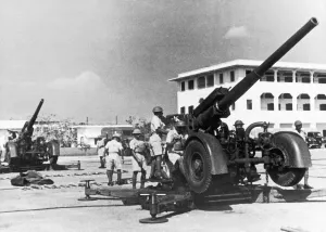 The Hong Kong and Singapore Royal Artillery (HKSRA) operating an anti-aircraft gun used