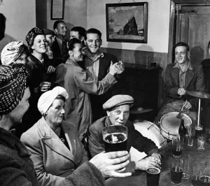 Agriculture Prints: Hop pickers with local men drinking at a country pub in Kent after a hard days work