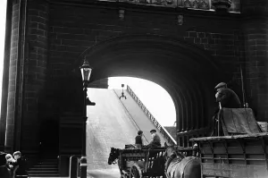 Commercial Prints: Horse drawn carts wait whilst Tower Bridge is raised Circa August 1936