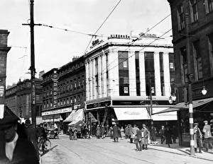 Tram Lines Prints: A horse pulls a small cart and an open top car travels up Newgate Street to the corner of