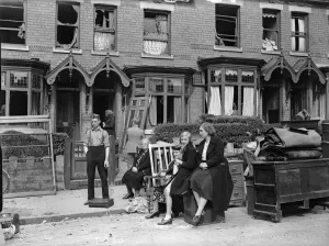Householders removing furniture from their bomb damage home in Smallheath