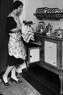 Crockery Prints: Housewife with her new Flecthers Queensday New World gas regulator oven and hob
