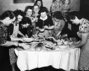 Housewives in East Ham London prepare sandwiches for a farewell party for soldiers