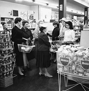 Housewives in search of a bargin at the Premier supermarket in North Finchley