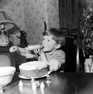 Howard Stanton Bottomley, 5, of Manchester having a go at icing a Christmas cake