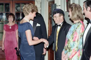 Pianist Prints: HRH Princess Diana, Princess of Wales is greeted by singer Elton John for a charity
