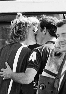 HRH The Princess of Wales, Princess Diana and Prince Charles have an affectionate kiss