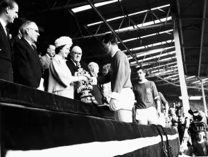 F A Cup Prints: HRH Queen Elizabeth II presenting the FA cup to Noel Cantwell