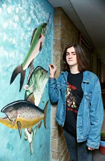 Huddersfield New College pupils are pictured by the mural they spent six months painting