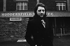 Huddersfield Town Frank Worthington with his Mustang car outside his team
