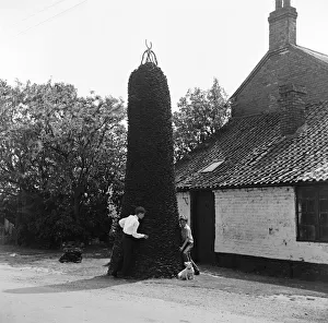 Blacksmith Prints: A huge stack of used horseshoes outside a blacksmiths workshop, Scarrington