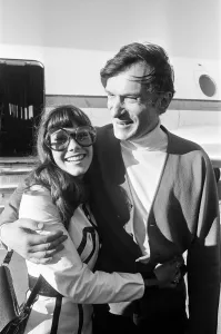 Magazine Prints: Hugh Hefner arriving at Gatwick Airport with his girlfriend Barbara Benton