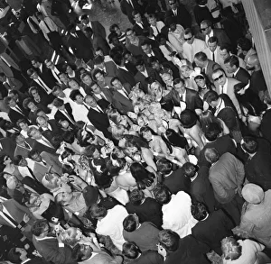 Hugh Hefner Boss of the Playboy Empire arrives with an entourage of Bunny Girls at London