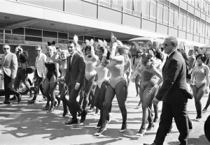Hugh Hefner Boss of the Playboy Empire arrives with an entourage of Bunny Girls at London