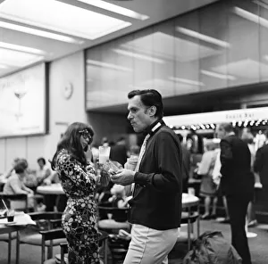 Magazine Prints: Hugh Hefner pictured with his girlfriend Barbi Benton at the airport. 6th September 1969
